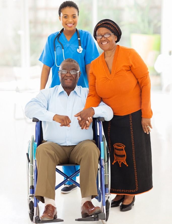 portrait of african female healthcare worker with senior couple at home